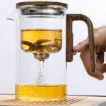 Tetera de contenedor interior con separación de agua, interruptor magnético de un clic, filtración de separación de té, tetera de vidrio, mango de madera para té 4 Tetera de contenedor interior con separación de agua, interruptor magnético de un clic, filtración de separación de té, tetera de vidrio, mango de madera para té 4